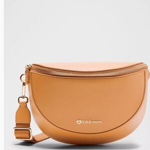 Leather Alternative Saddle Crossbody Bag 2L in chestnut brown NWT